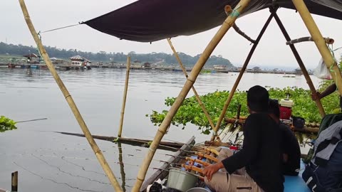 camping together on a fishing raft