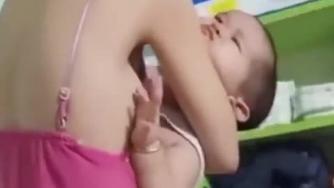 Beautiful Asian mom breastfeeding baby