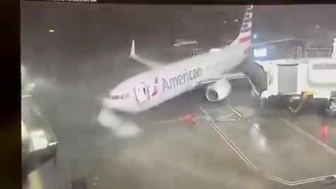 American Airlines 737-800 moved from its gate at Dallas Airport because of weather conditions