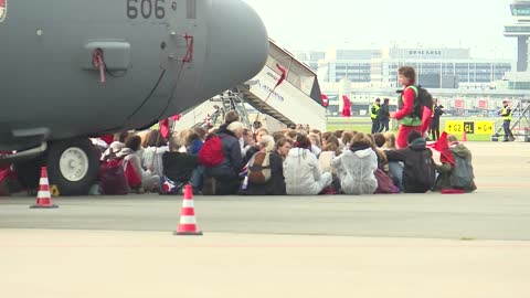 Climate activists occupy tarmac at Amsterdam's Schiphol airport