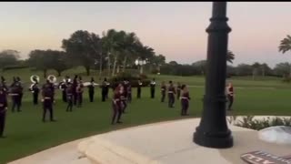 President Trump reviews the marching band performing at his annual Super Bowl party