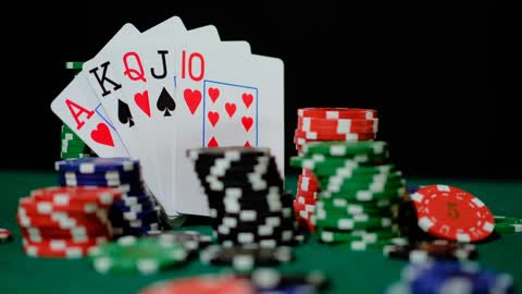 Poker chips and cards arranged in an image composition