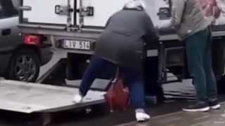 Truckers help an elderly woman get to her car!