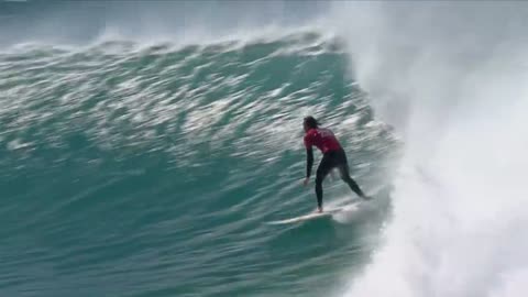 Shark swims & jumps as surfer lands perfect 20 heat total