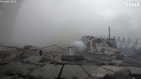 Russian tanks storm urban battlefield blasting Ukrainian fortifications