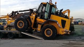 Heavy jcb loading in a truck