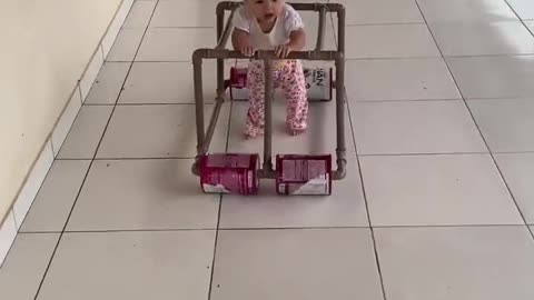 Baby Takes a Stroll in Homemade Walker