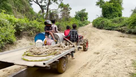 #79-driver tractor go transport water at the river