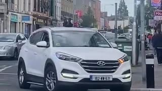 Ireland: immigrant jumps onto a random persons car and refuses to get off.