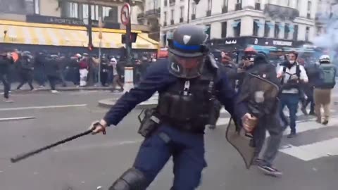 Man getting hit in the face by French police