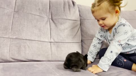 Adorable Little Girl Treats Her Baby Bunny Like A Baby! (Cutest Ever!!)