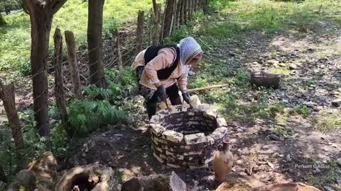 Two ladies cook ostriches