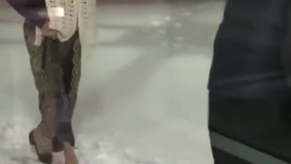 Man clears snow path so wife can walk