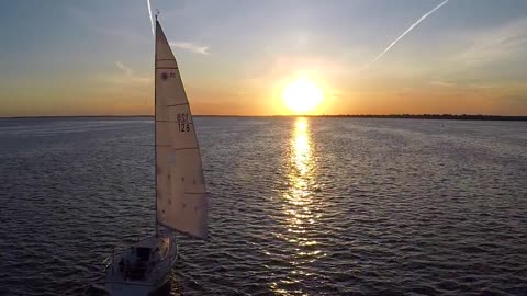 Sailboat sailing during sunset