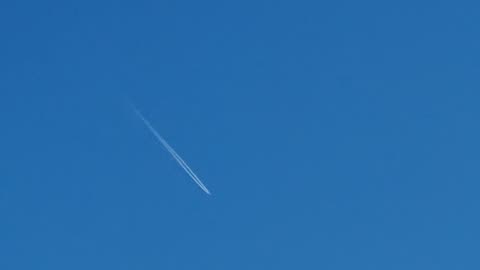 Contrail Behind Aeroplane Above North Wales.