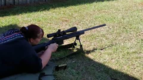Laura shooting the 6.5mmCM and 338 LM by area318.com