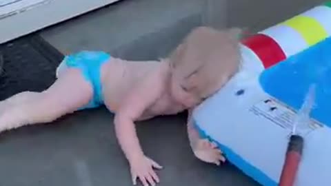 Lucky baby in bathtub playing