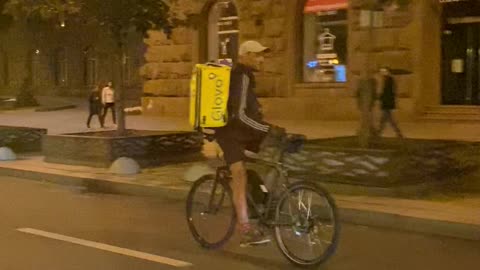 Food Delivery Guy Rides Backward