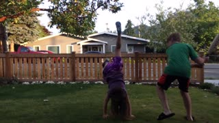 Boy Hits Sister With Plastic Bat While She Does A Flip