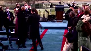 Former presidents bump fists, elbows at inauguration