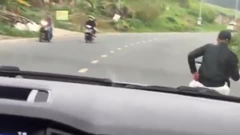 See how dangerous it is to ride a motorbike in front of a car.
