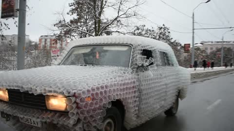 Car Covered in Cups