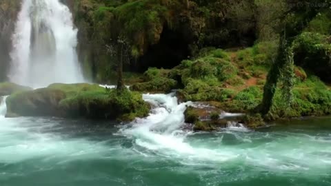 Waterfalls with a flowing river