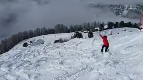 Woman red jacket ski stuck flips