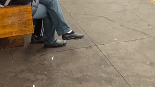 Woman in black jacket eating popcorn