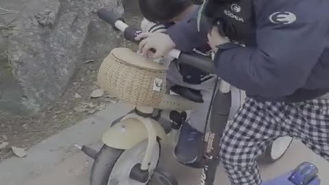 Baby sleeping on a bicycle