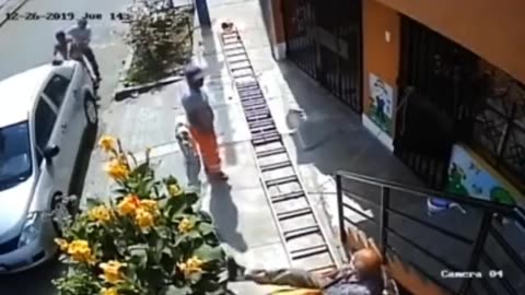 Elderly Man In Wheelchair Shakes Painter’s Ladder Causing Terrifying Fall To The Pavement