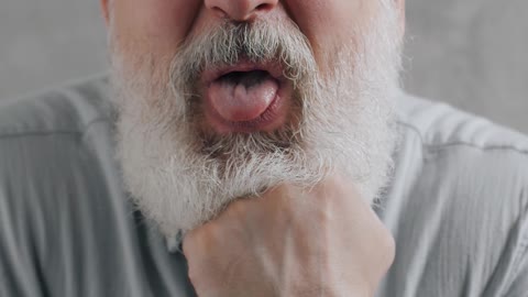Elderly Man Sticking His Tongue Out