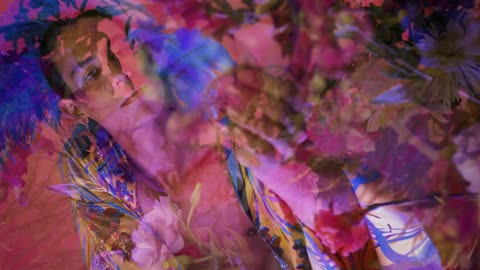 Concept video of an LGBTQ man surrounded by flowers