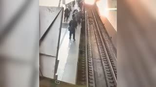 Woman On Phone Falls On Tracks As Tube Approaches