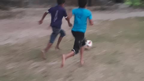 Some kids playing football