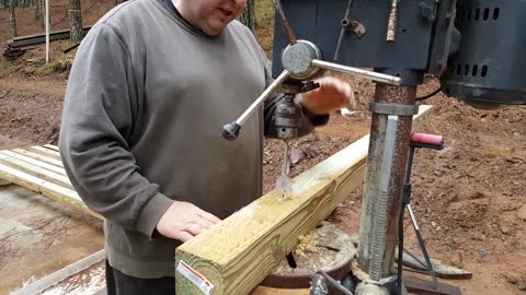 Drilling the beams to fit the trolley