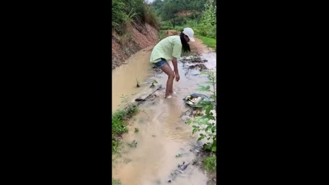 Pretty Lady Catches Fish Stuck in Small Canal 🐟