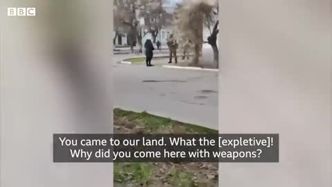 Ukrainian Woman Confronts Armed Russian Soldier.