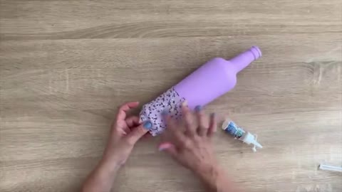 Oh, it's a purple bottle with a floral cloth attached