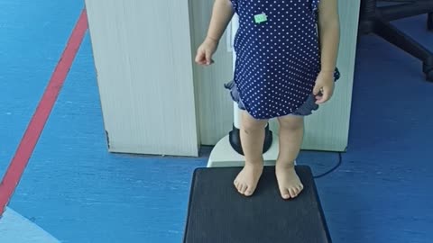 Baby Weighing Herself