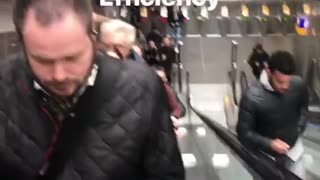 Efficiency man runs up down escalator