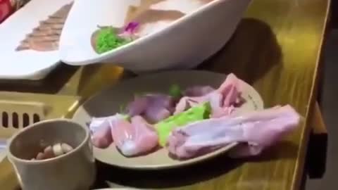 Raw chicken seemingly crawls off table by itself