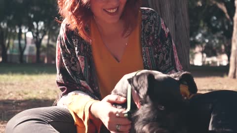 A Woman Petting Her Dog