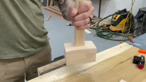 Hammer A Stick Into A Piece Of Wood
