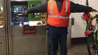 Man flaps his arms like a bird and makes bird noises in subway station