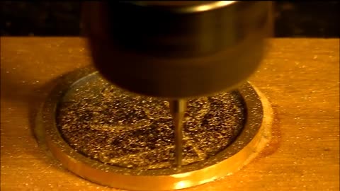 Machining demonstration of a solid brass $ Dollar coin medallion