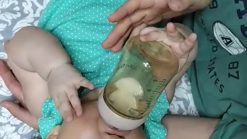 A baby who drinks milk powder.