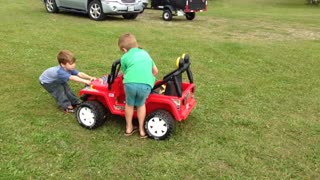 Little Boy Hangs On While Tiny Friends Speed In Power Wheels