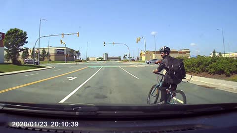 Lucky Cyclist Darts in Front of Traffic