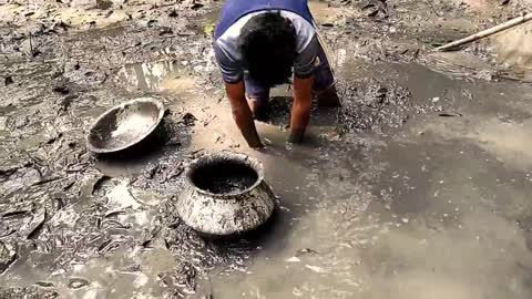 Fishing from village pond in Bangladesh